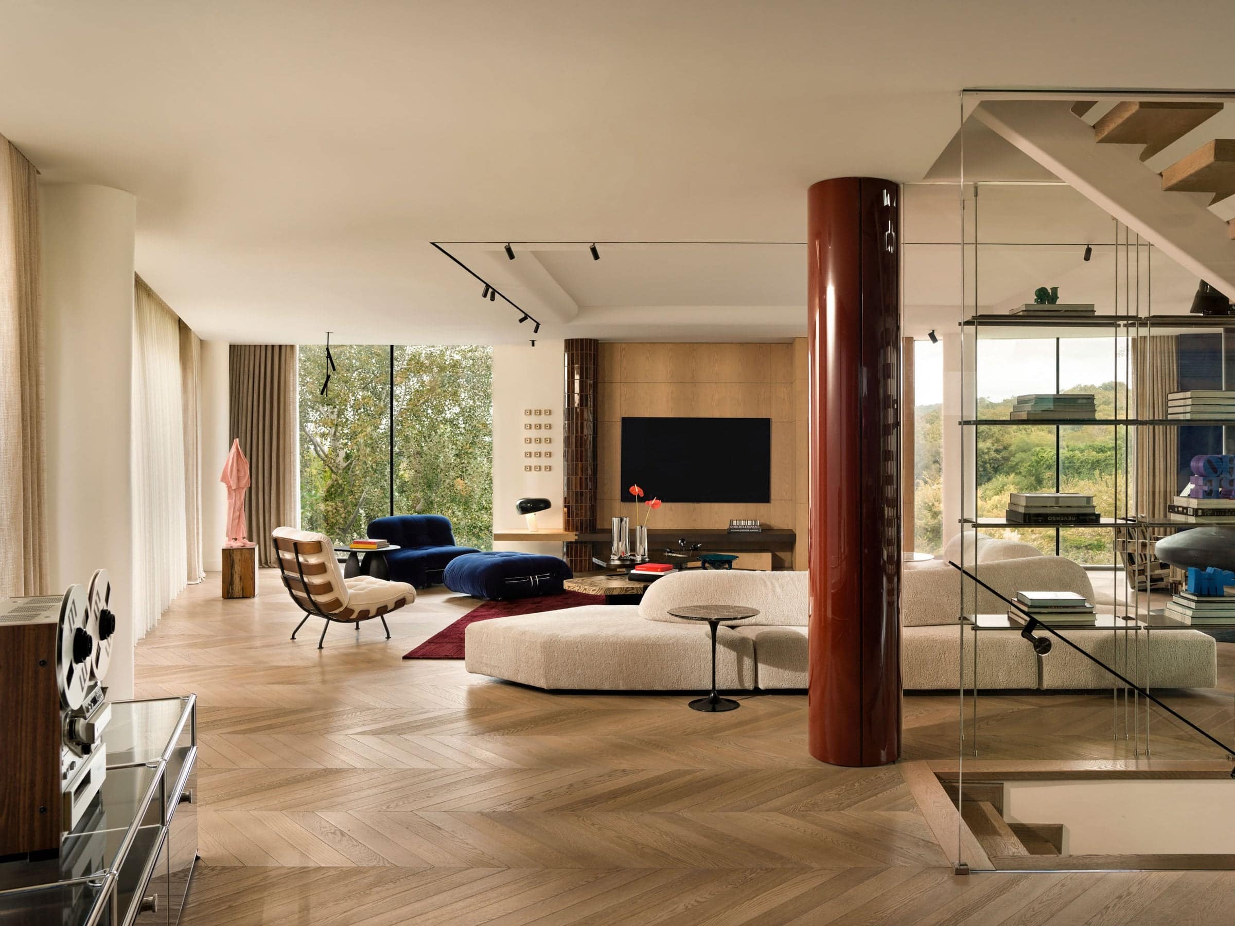 ZTP House at the wooded edge, framed by floor-to-ceiling glazing
