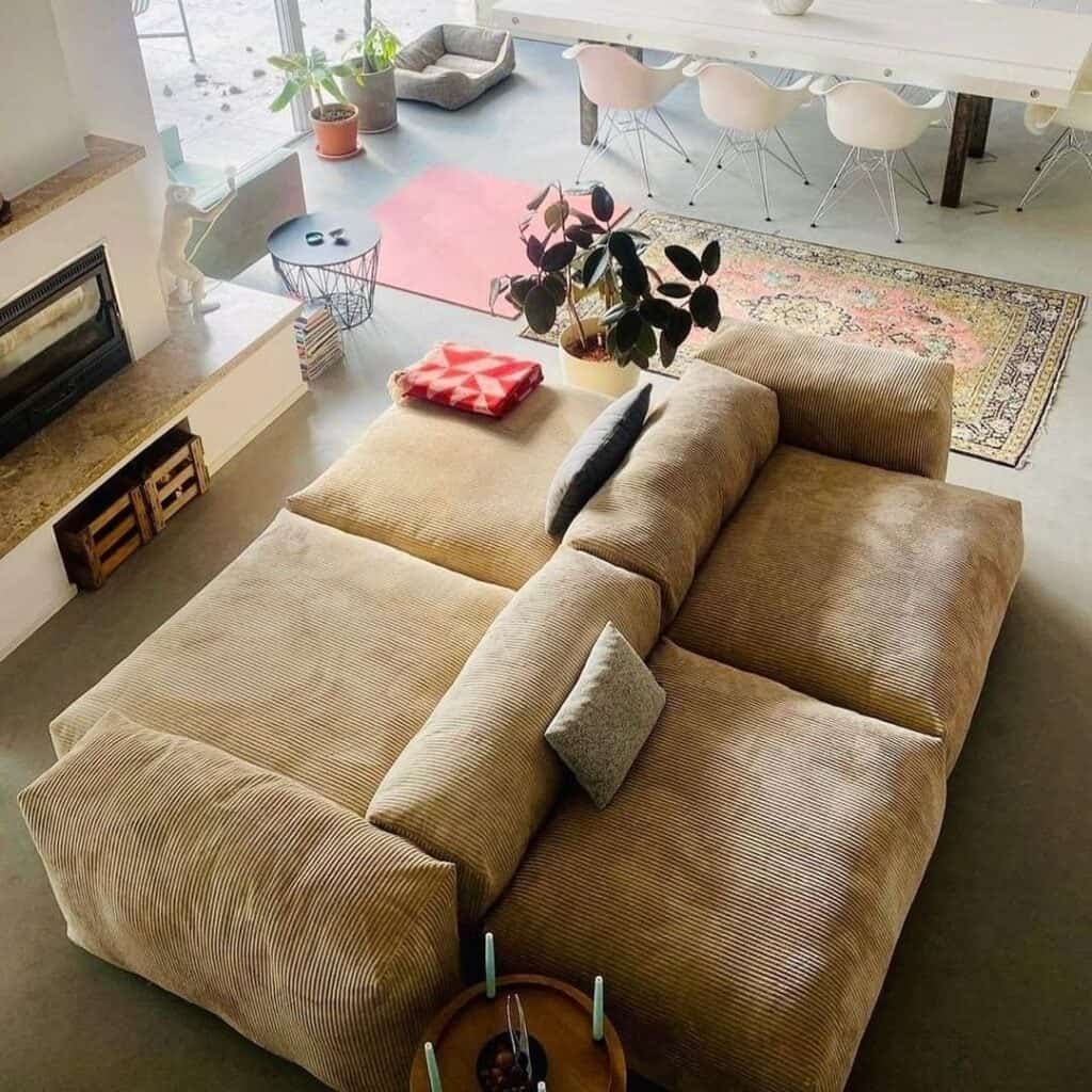 modular sofa replica by vetsak in front of fireplace