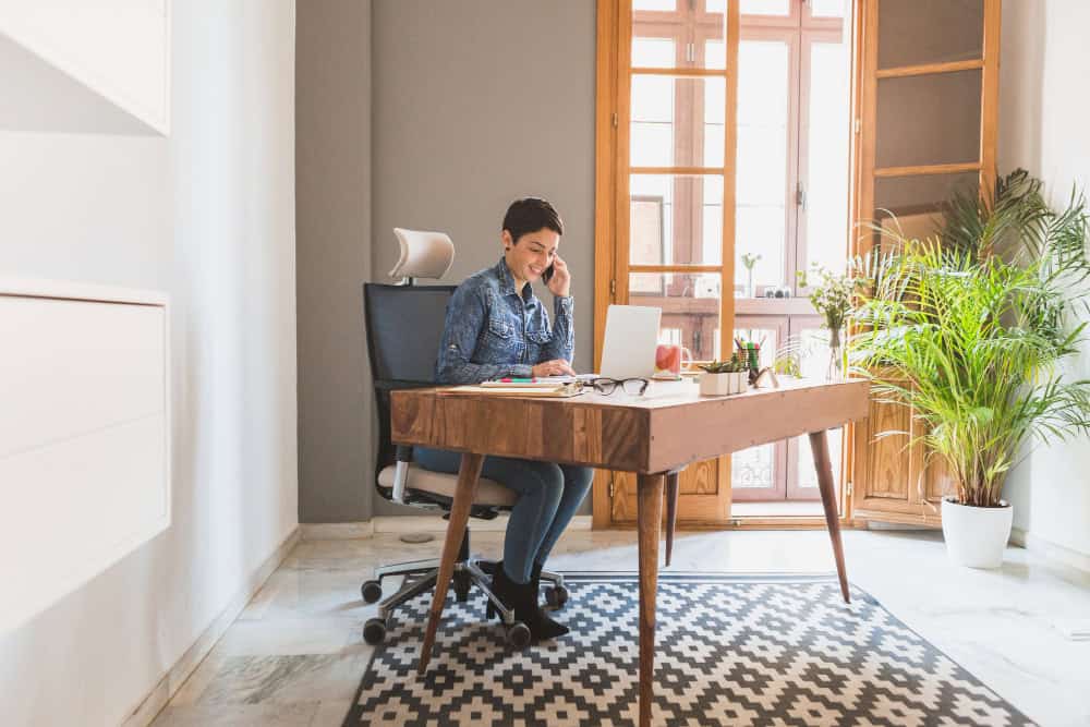 Ergonomic workspace furniture including a wooden desk and chair designed for comfort and balanced work.