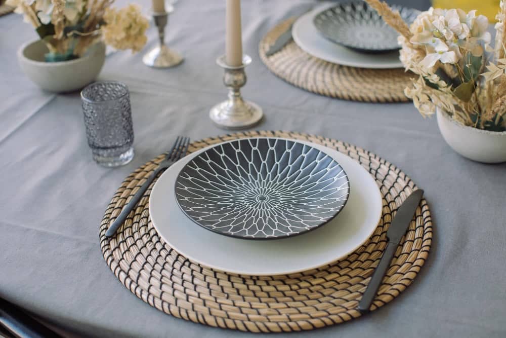 Clean marble dining table surface with coasters and placemats to maintain an elegant timeless look.