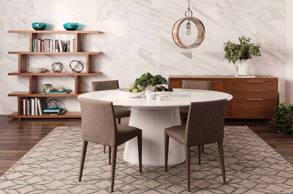 Marble dining table with mixed upholstered and cane chairs, creating a balanced contemporary setup.