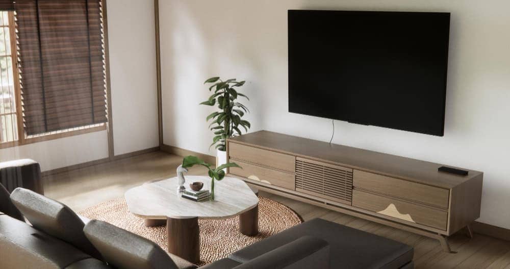 Minimalist furniture and wall-mounted TV showing calm and intentional small living room ideas with TV.