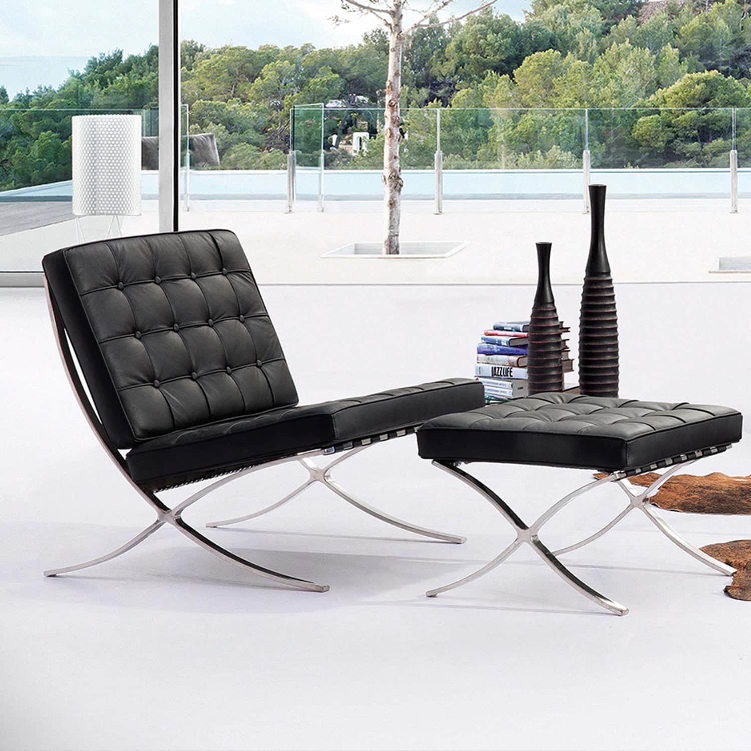 Elegant Barcelona Chair Replica with Stool, dressed in genuine leather upholstery and seated on a mirror-like polished stainless-steel base, embodying modern luxury and sophisticated design.