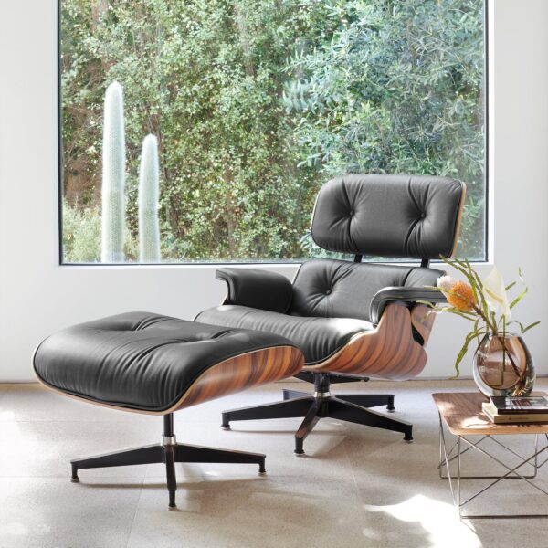 A luxurious Eames Lounge Chair and Ottoman replica (Premier Tall Version) in top-grain leather, showcasing mid-century executive style and unparalleled comfort.