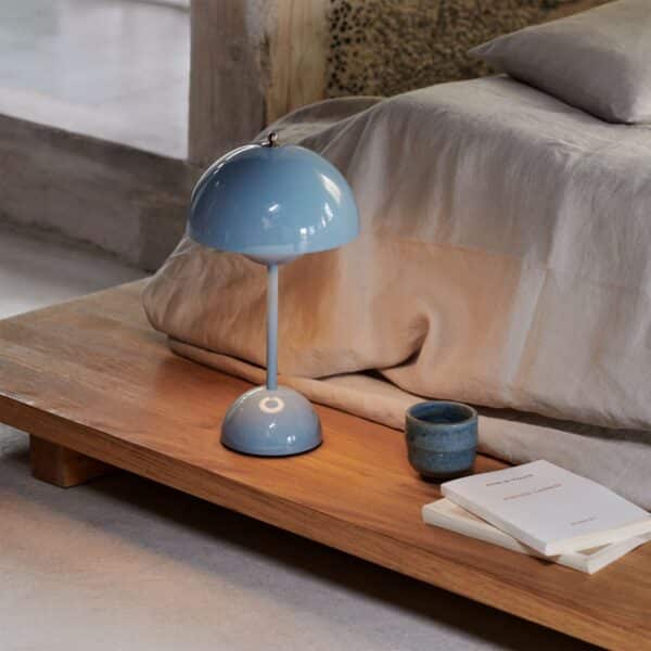 Flamingo Table Lamp is a round, white sphere, placed on top of the bird's slender neck, emitting a warm and inviting glow.