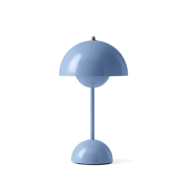 Flamingo Table Lamp is turned on, casting a warm and cozy glow in a dimly lit room.