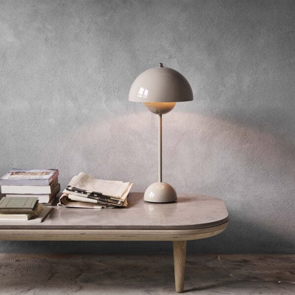 A grey Flamingo Table Lamp by sohnne, featuring two semi-circle spheres facing each other.