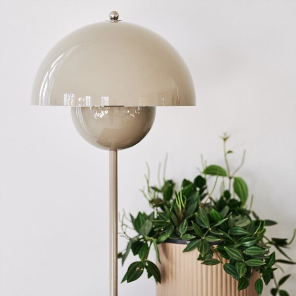 Flamingo Table Lamp features a lacquered metal silhouette with a rounded shade resembling a hotel bell.