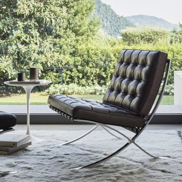 Barcelona Chair Replica with polished chrome frame and genuine leather upholstery.