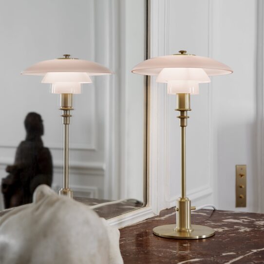 Pomelo Table Lamp sits atop the base, with a black cord trailing down the side.