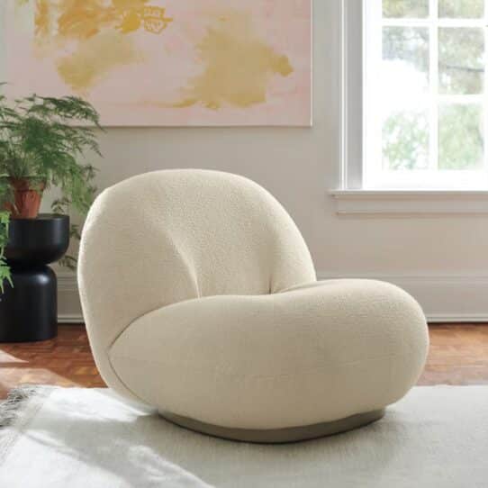 Pacha Lounge Chair Replica - Curvy, low-slung outdoor lounge chair with plush cushions and minimalist design.