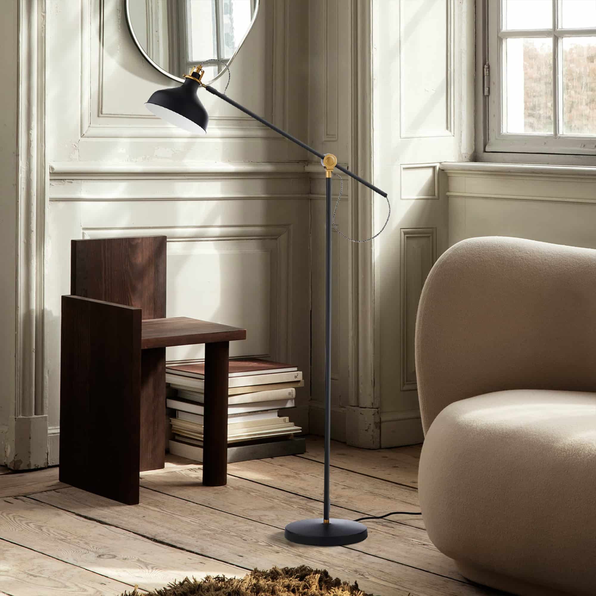 An elegantly designed Calisto Floor Lamp with sleek metallic accents, adjustable angles, and a stable base preventing tipping.