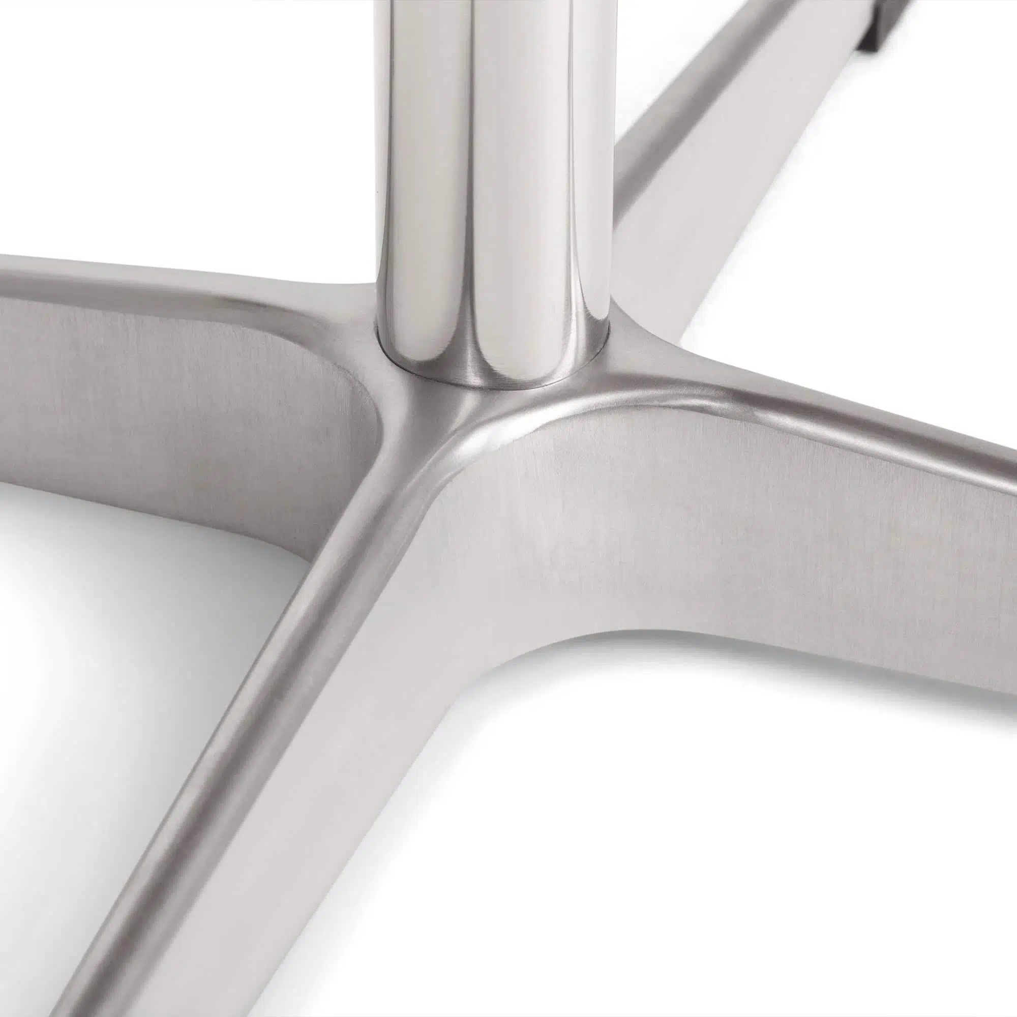 Close-up detail of the chrome pedestal base of a chair.