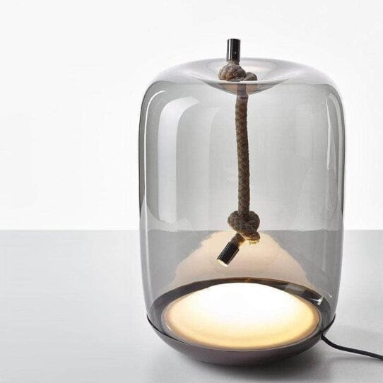 Sans Table Lamp Perfect for a minimalist home office or a cozy living room.