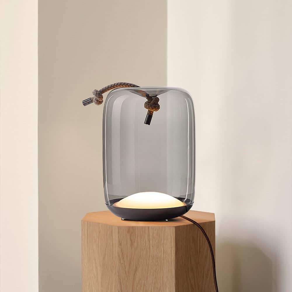 Sans Table Lamp by Sohnne is made of metal, blown glass, and a rope.