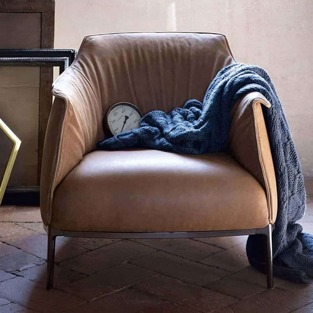 Create a cozy and stylish living space with the Archibald Armchair Replica, featuring a contemporary design that adds sophistication and comfort to any room