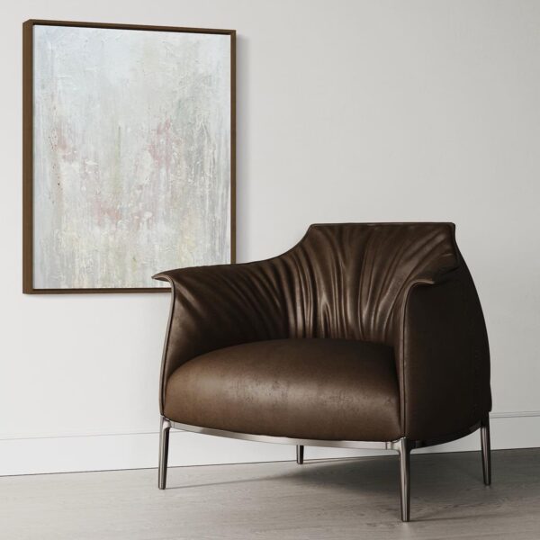 Experience ultimate comfort with the Archibald Armchair Replica, featuring a spacious and plush cushion with a foam core for excellent support.