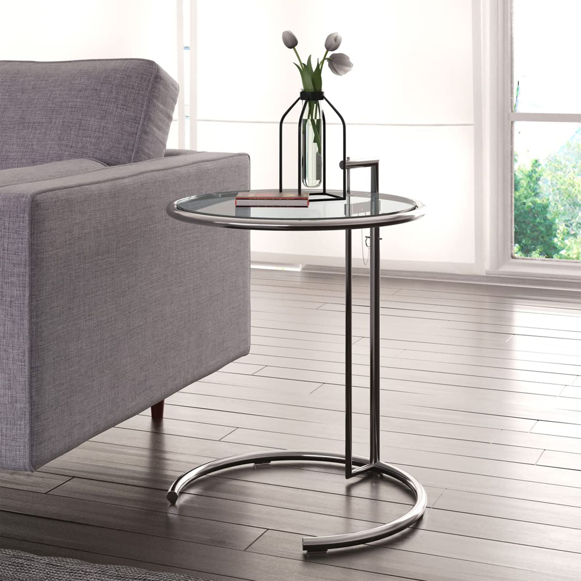A modern and stylish E1027 Side Table Replica with high-quality stainless steel construction, featuring an adjustable, tiltable top.