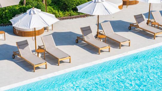 Umbrella and deck chair around outdoor swimming pool in hotel resort | Sohnne® umbrella deck chair around outdoor swimming pool hotel resort nearly sea beach ocean scaled - Best Pool Lounge Chair, summer, comfort