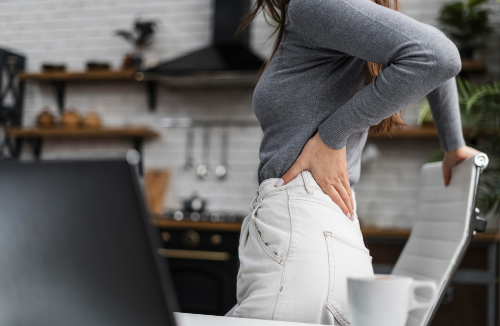 woman experiencing back-pain due too prolonged seating