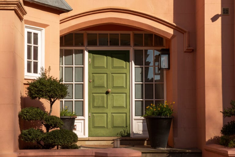 green front door salmon colored house