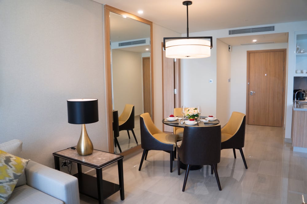 12324 | Sohnne® Apartment living room decor ideas using mirrors to reflect sunlight and make small spaces look larger.