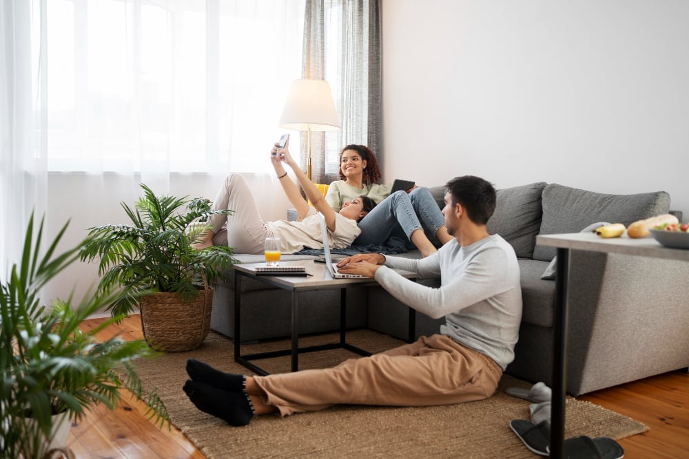 2149485669 | Sohnne® Friends relaxing in a cozy living room apartment decor setup featuring modular furniture.