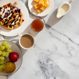 Modern dining room featuring a marble dining table that blends timeless style with everyday functionality.